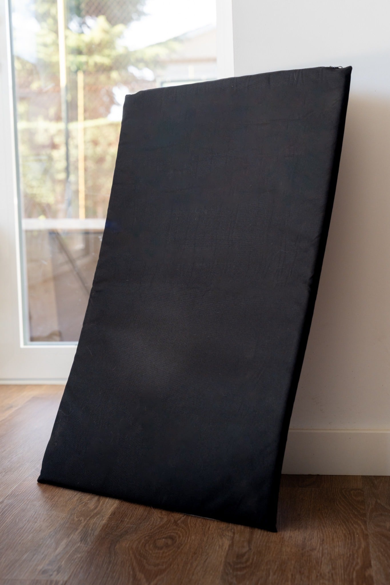 Robust Comfort Mat standing upright, showing its thickness and construction.
