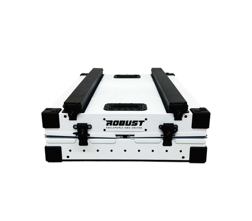 White Robust collapsible dog crate folded flat for transport and storage.