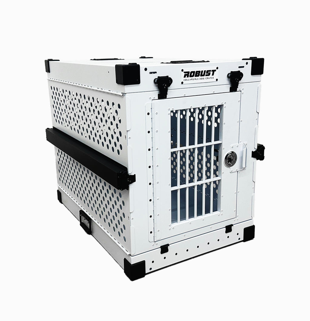 Three-quarter view of the white Robust collapsible dog crate showing the ventilated side panels.