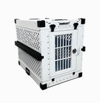 Three-quarter view of the white Robust collapsible dog crate showing the ventilated side panels.